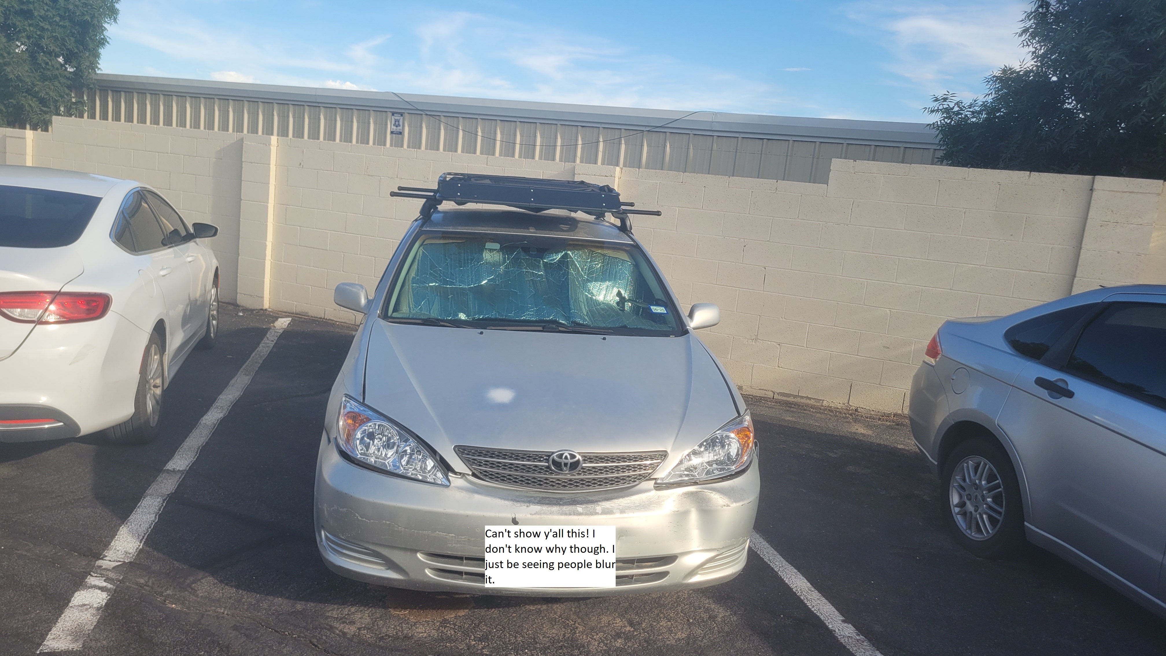 My car with a new roof rack for extra storage during travels.